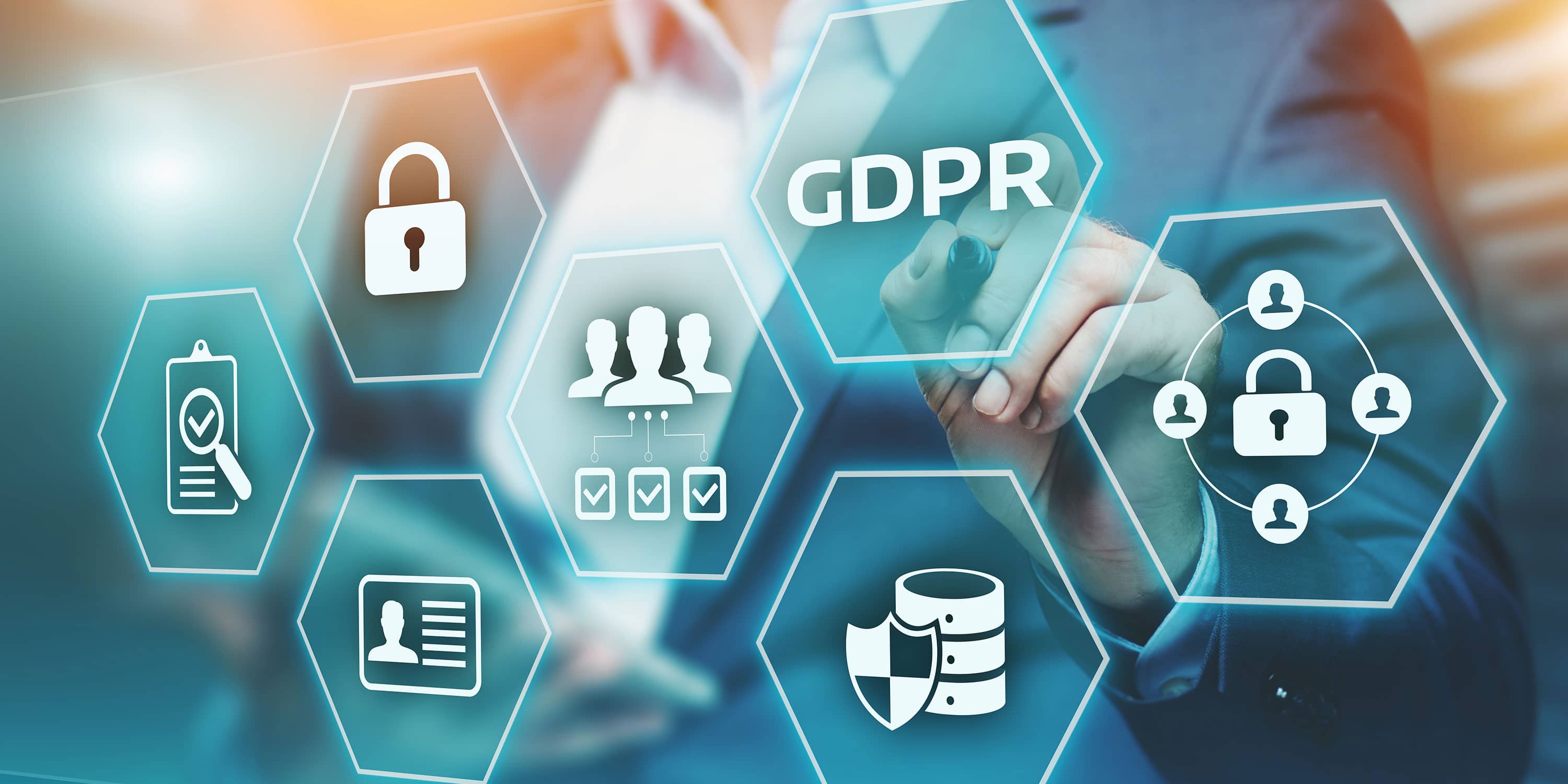 A person touching a transparent hexagonal interface labeled "GDPR". Surrounding hexagons depict icons like a lock, checklist, shield, ID card, and group of people, symbolizing data protection and privacy. The background is blurred with a mix of cool colors.